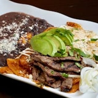 Red Chilaquiles with Grilled Steak, Eggs, & Beans