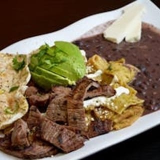 Green Chilaquiles with Grilled Steak, Eggs, & Beans